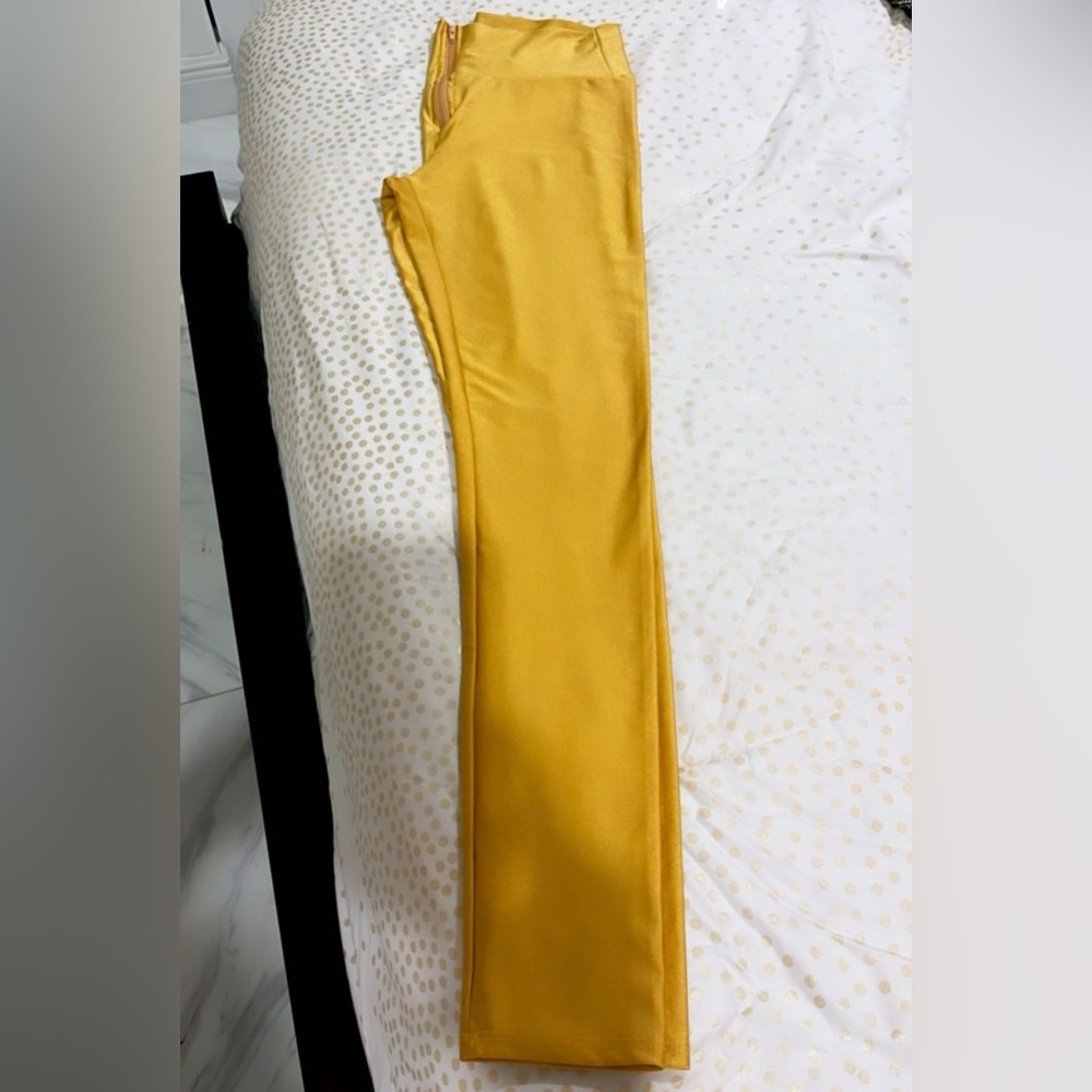 Gold color leggings with zipper in Small. Great condition wore 2 times